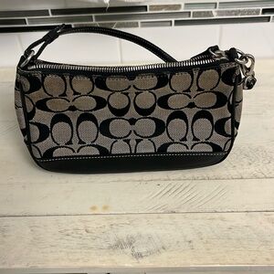 Coach wristlet/clutch, black/gray signature pattern. 9 1/2”x 5 1/4” x 2”